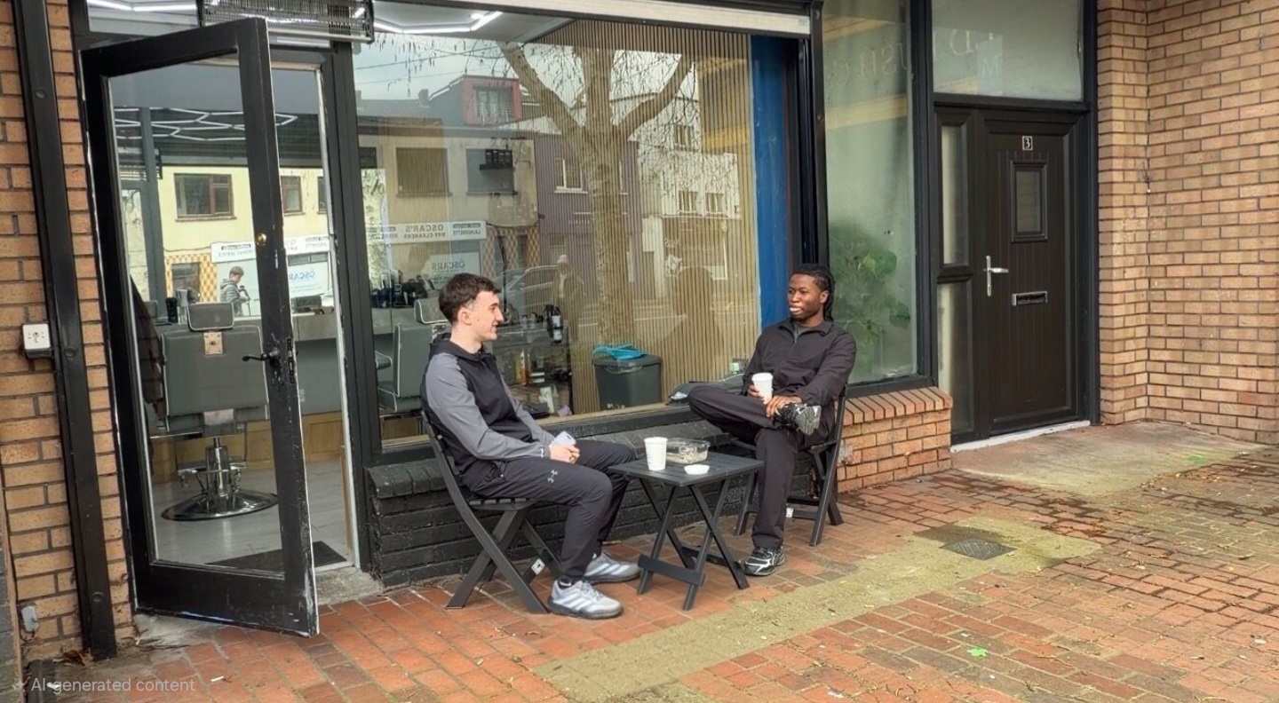 Kleens Barbershop owners talking outside the shop